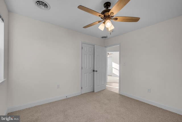 unfurnished bedroom with visible vents, ceiling fan, baseboards, and carpet floors