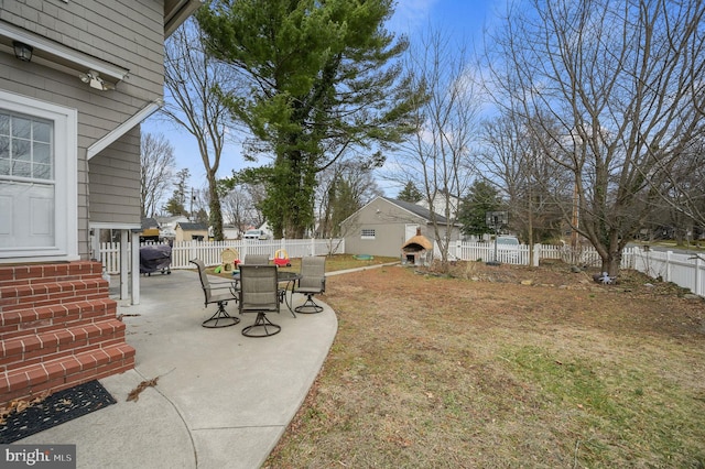 view of yard with a patio area and a fenced backyard