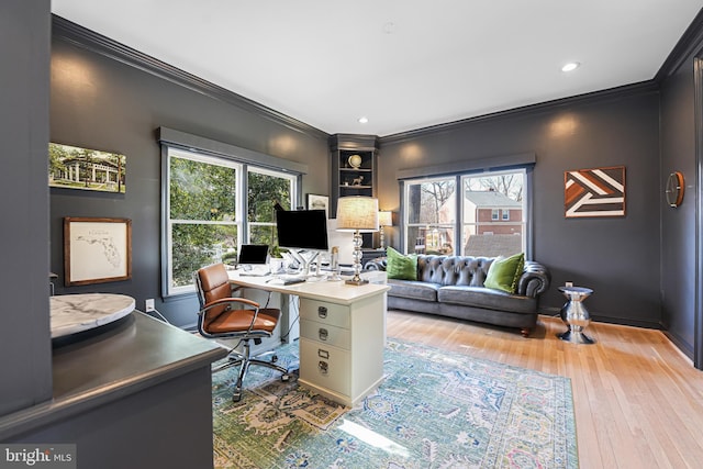 office area featuring hardwood / wood-style flooring, recessed lighting, baseboards, and ornamental molding