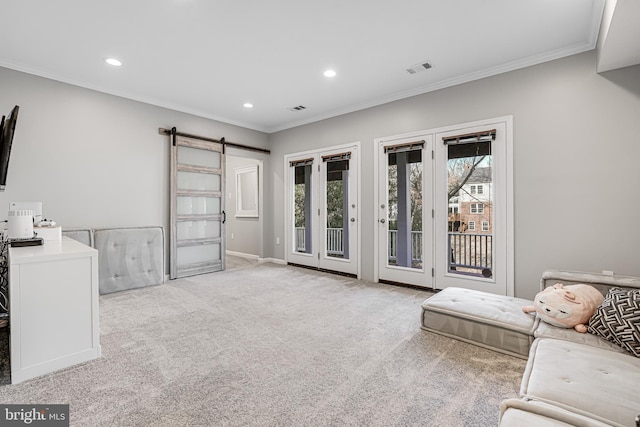 interior space with access to outside, recessed lighting, a barn door, carpet floors, and crown molding