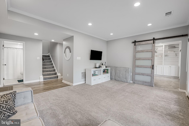 unfurnished living room featuring visible vents, stairs, a barn door, carpet floors, and recessed lighting