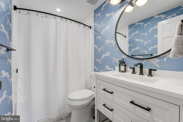 full bath with visible vents, toilet, wallpapered walls, and vanity