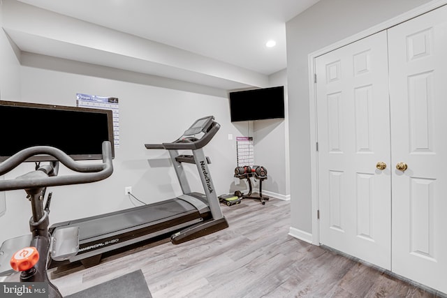 exercise room featuring recessed lighting, baseboards, and wood finished floors