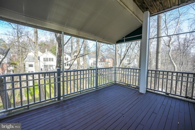 wooden terrace featuring a residential view