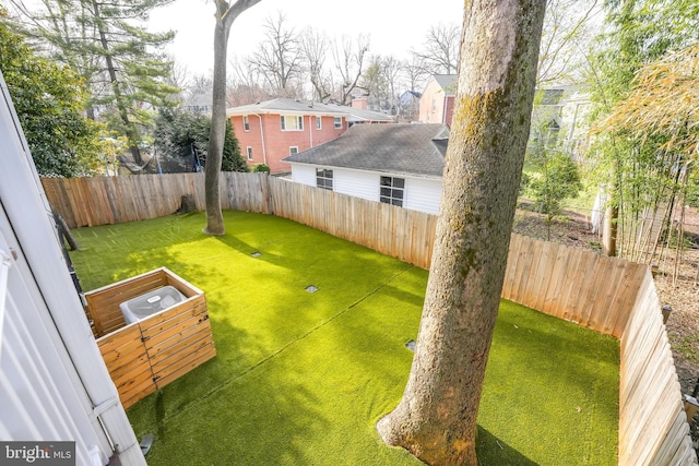 view of yard with a fenced backyard