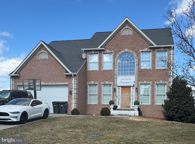 view of front of property with brick siding, an attached garage, concrete driveway, and a front yard