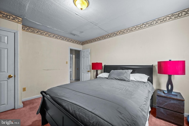 carpeted bedroom featuring baseboards