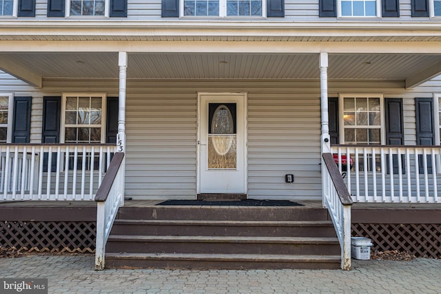 entrance to property with a porch