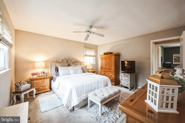 bedroom with carpet floors and a ceiling fan