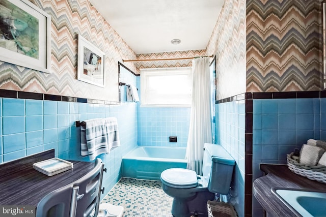 full bathroom featuring tile patterned flooring, toilet, tile walls, and shower / bath combo with shower curtain