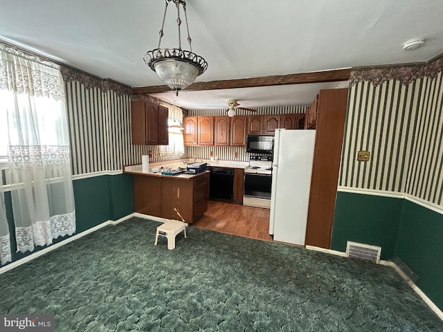 607 Braxton Rd, Ridley Park, PA 19078 - kitchen featuring black appliances, carpet flooring, a peninsula, light countertops, and baseboards