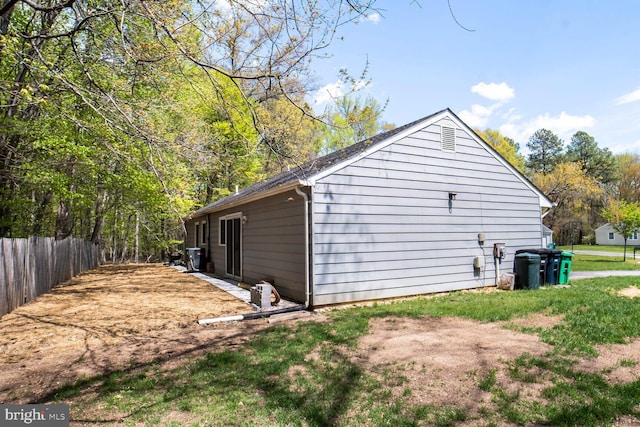 view of side of property with fence
