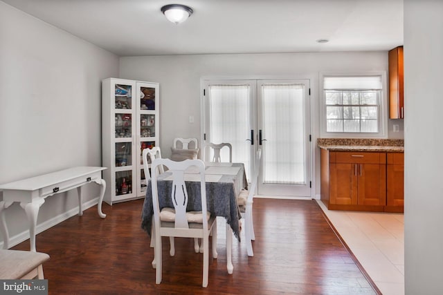 dining area featuring french doors and wood finished floors
