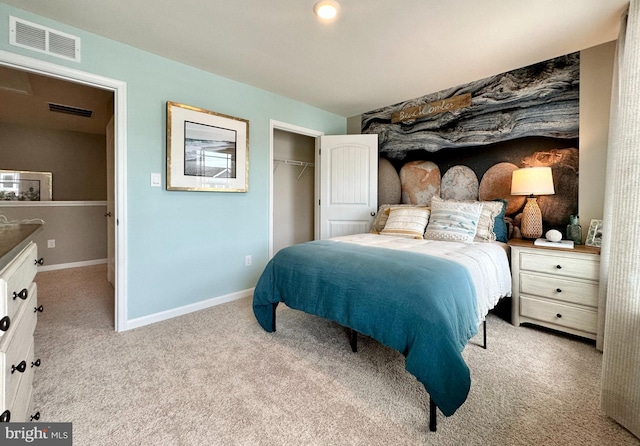 carpeted bedroom featuring baseboards, visible vents, and a closet