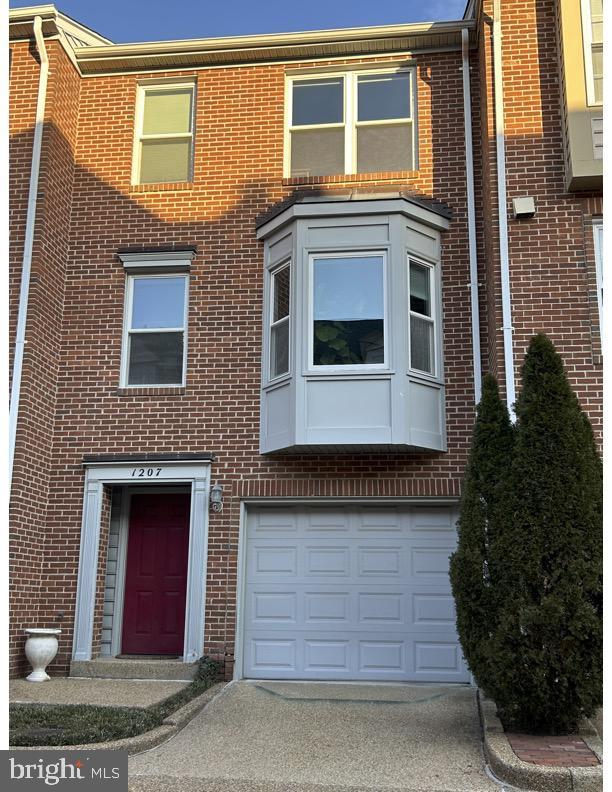 view of property with brick siding