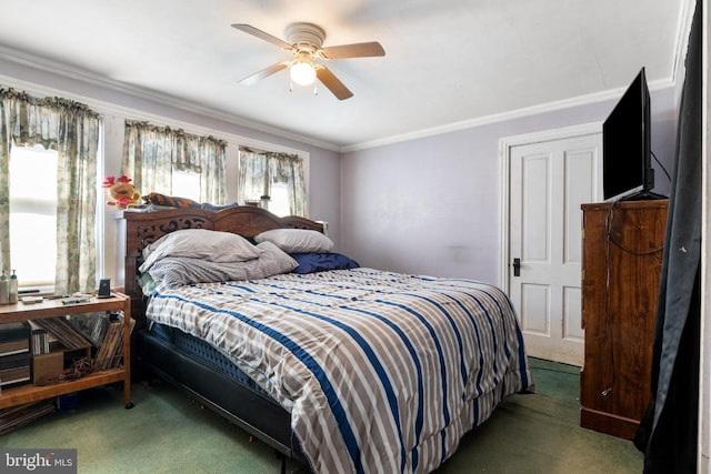 carpeted bedroom with crown molding and ceiling fan