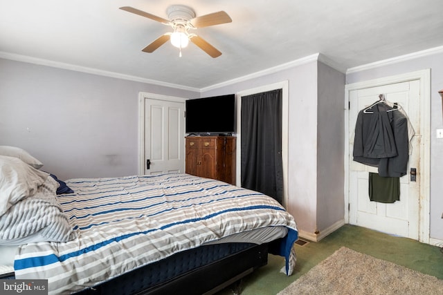 bedroom with carpet flooring, baseboards, a ceiling fan, and crown molding