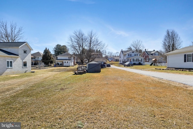 view of yard featuring a residential view