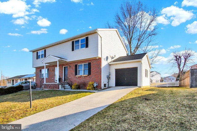 view of front of house featuring a front lawn, fence, concrete driveway, a garage, and brick siding