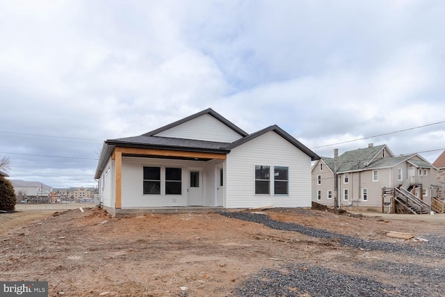 view of front of home featuring a shingled roof