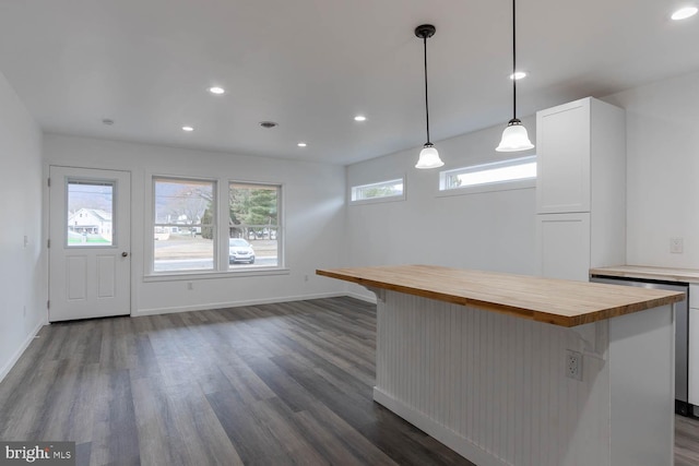 kitchen featuring baseboards, wooden counters, recessed lighting, dark wood-type flooring, and white cabinets