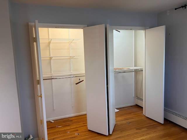 closet with a baseboard radiator