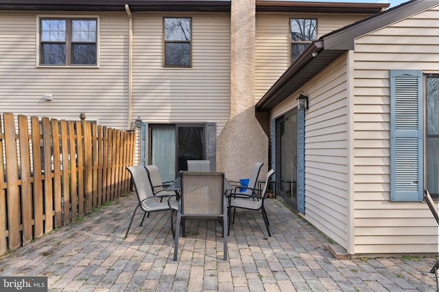 view of patio / terrace with outdoor dining area and fence