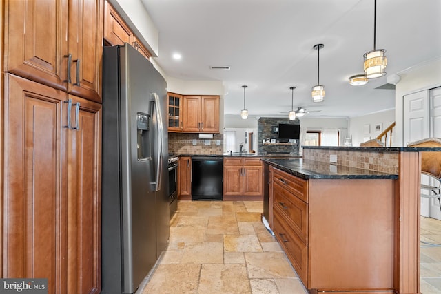 kitchen with black dishwasher, stone tile floors, stainless steel fridge, brown cabinetry, and ceiling fan