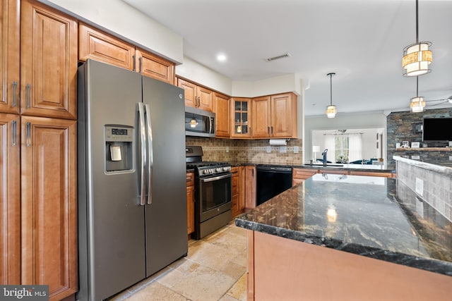 kitchen with visible vents, decorative backsplash, brown cabinets, stone tile flooring, and stainless steel appliances