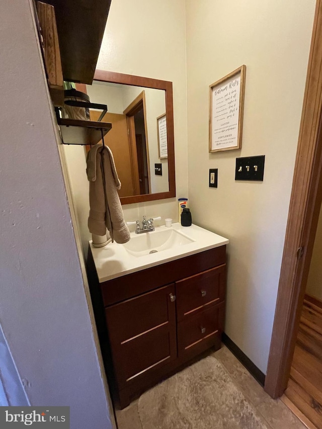 bathroom featuring vanity and baseboards