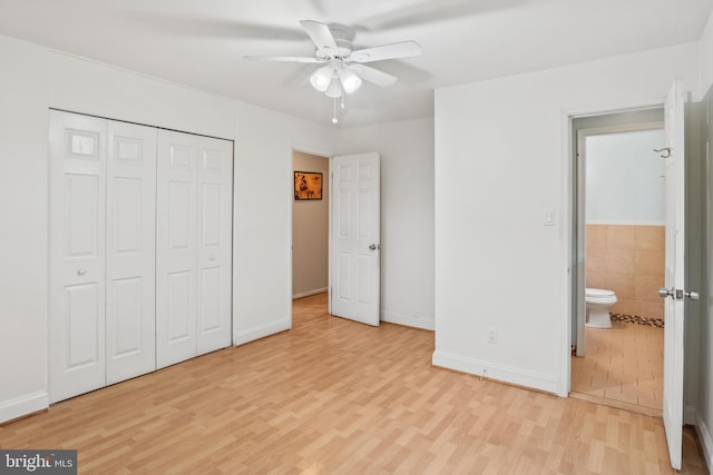 unfurnished bedroom with light wood-type flooring, baseboards, a closet, and a ceiling fan