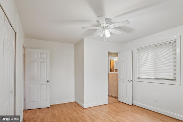 unfurnished bedroom with baseboards, light wood-type flooring, and ceiling fan