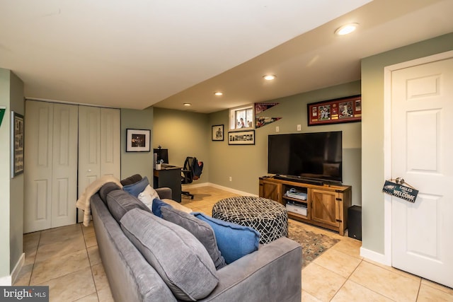 living room with light tile patterned floors, baseboards, and recessed lighting