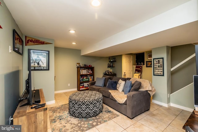 living room featuring light tile patterned floors, recessed lighting, and baseboards