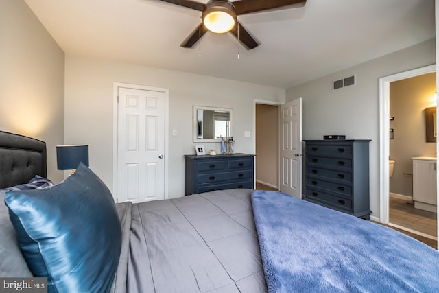 bedroom with visible vents, ensuite bath, and ceiling fan