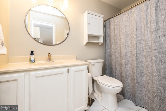 full bath featuring vanity and toilet