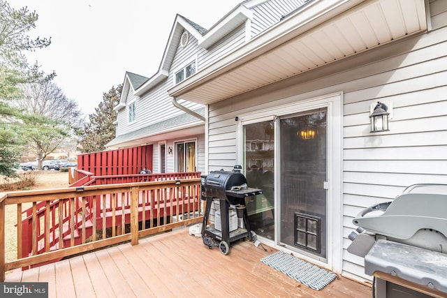 wooden terrace featuring grilling area