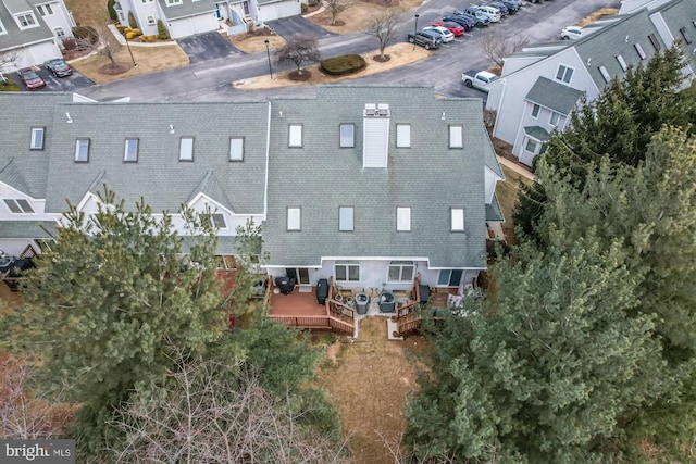 birds eye view of property with a residential view