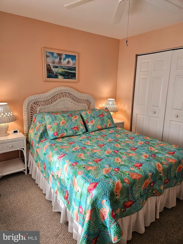 carpeted bedroom with a closet and ceiling fan