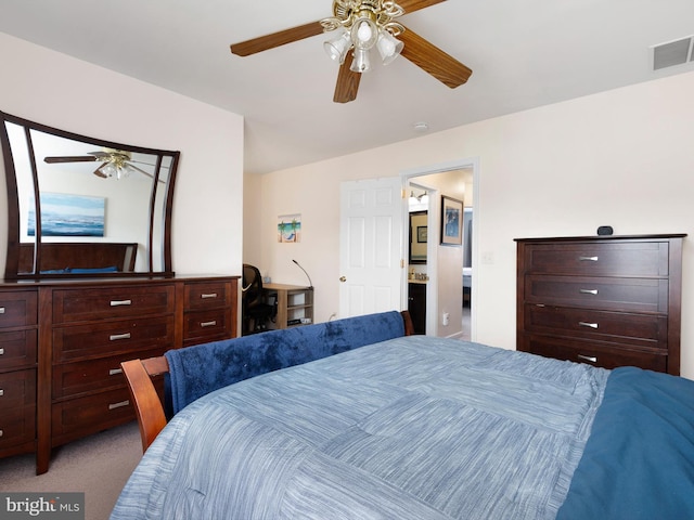 bedroom featuring visible vents, a ceiling fan, and carpet