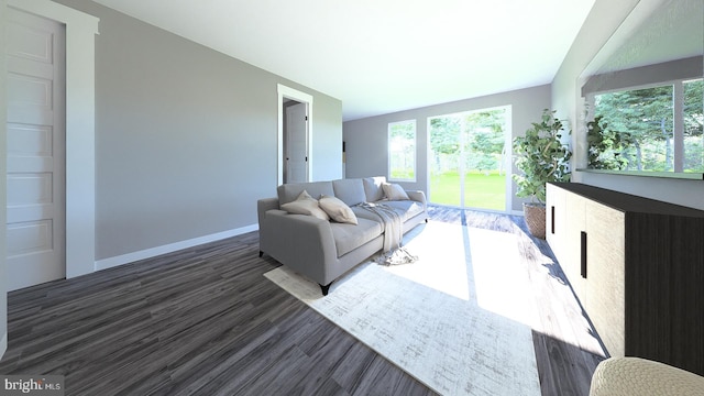 living area with plenty of natural light, baseboards, and wood finished floors