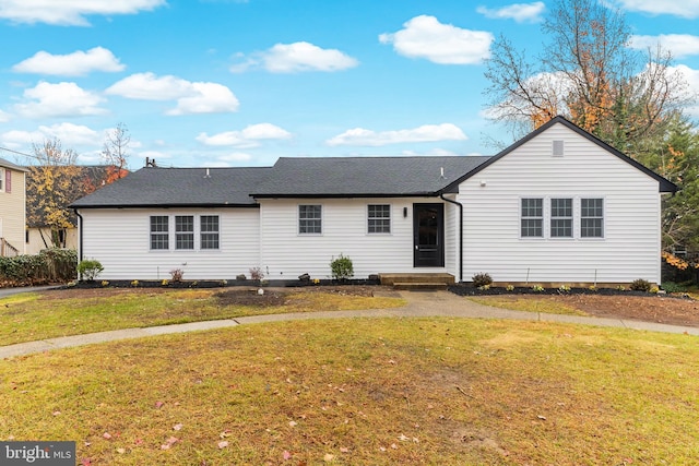 single story home with a front yard and a shingled roof