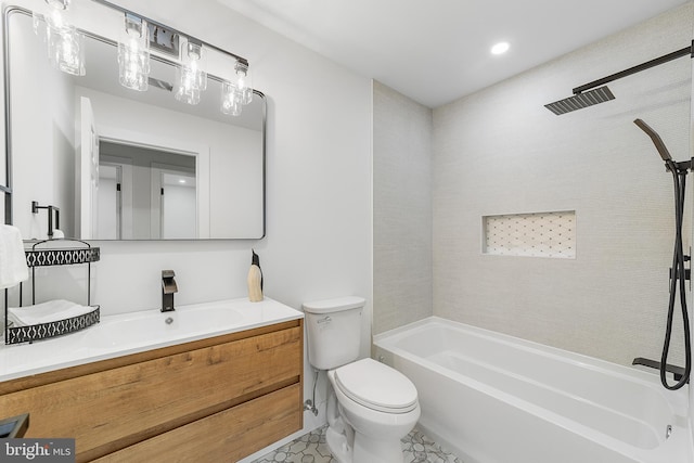 full bathroom featuring toilet, vanity, and washtub / shower combination