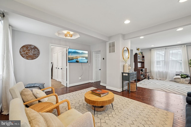 living area featuring recessed lighting, visible vents, wood-type flooring, and baseboards