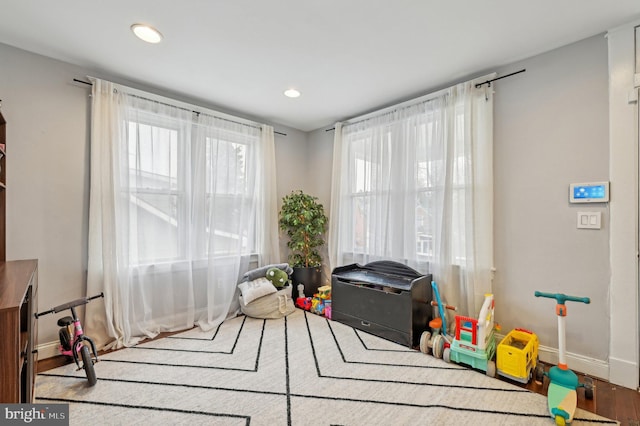 rec room with recessed lighting and baseboards