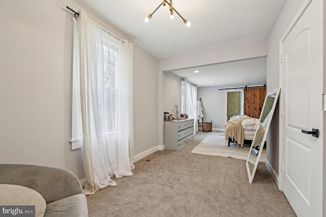 carpeted bedroom featuring recessed lighting, multiple windows, baseboards, and a barn door