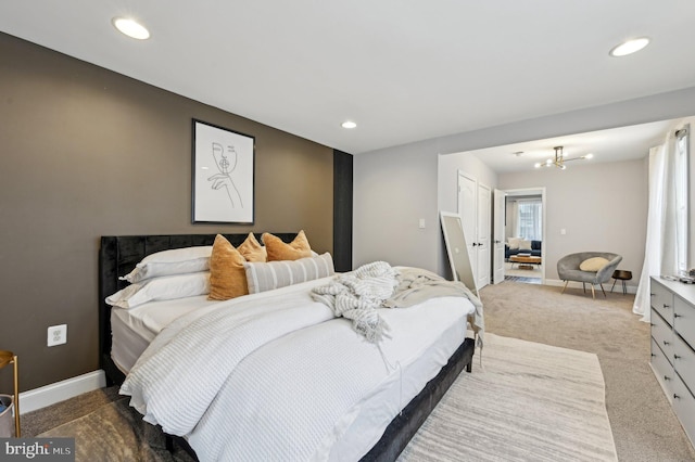 bedroom featuring an inviting chandelier, carpet flooring, recessed lighting, and baseboards