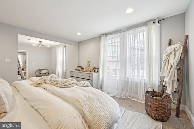 bedroom with recessed lighting, baseboards, and carpet floors