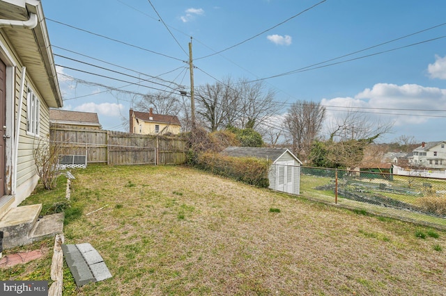 view of yard featuring an outbuilding and a fenced backyard