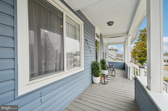 wooden terrace featuring a porch